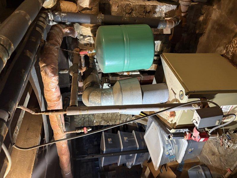 Conducted on-site assessment of boiler system experiencing active leak in mechanical room. Documented existing equipment configuration including pressure tank, piping connections, and control components. Provided estimate for necessary repairs to address leak and restore system to proper operating condition.