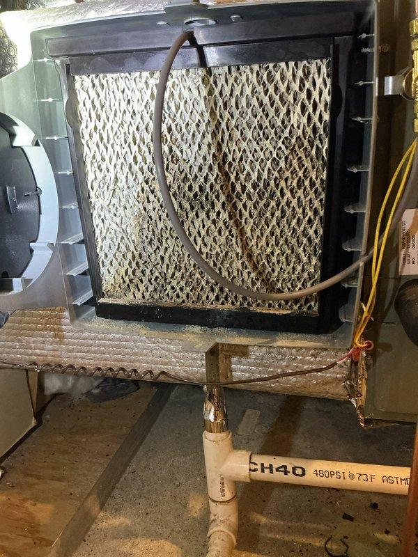 Responded to no-cooling call on ERV system with easy access panel. Upon inspection, found evaporator pad/filter with honeycomb mesh pattern requiring attention, verified refrigerant line connections, and measured clearances for proper airflow and component access. System components evaluated and service completed to restore normal operation.