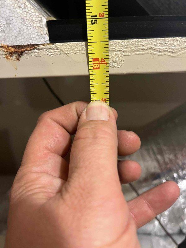 Responded to no-cooling call on ERV system with easy access panel. Upon inspection, found evaporator pad/filter with honeycomb mesh pattern requiring attention, verified refrigerant line connections, and measured clearances for proper airflow and component access. System components evaluated and service completed to restore normal operation.