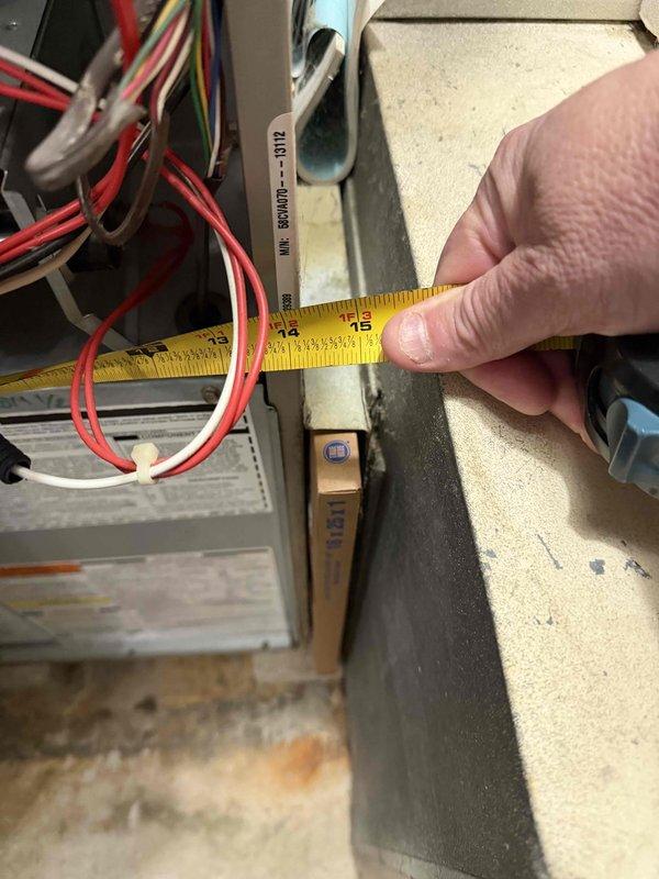 Provided estimate for replacement of 15-year-old furnace system. Performed on-site assessment including measurements of existing equipment and documentation of current HVAC configuration and adjacent water heater installation to determine proper replacement specifications.