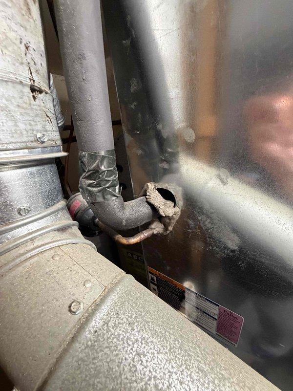 Provided estimate for replacement of 15-year-old furnace system. Performed on-site assessment including measurements of existing equipment and documentation of current HVAC configuration and adjacent water heater installation to determine proper replacement specifications.