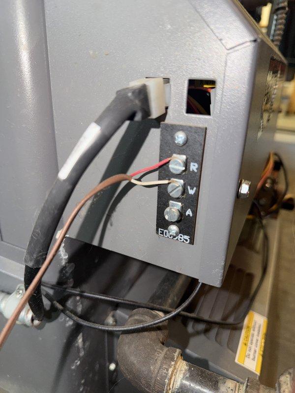 Completed comprehensive maintenance inspection on boiler system under service agreement. Documented system components including main supply ductwork and electrical control board with terminal connections for thermostat wiring (R, W, and A terminals). All accessible components were visually inspected and photographed for service records, with system found to be operational at time of visit.