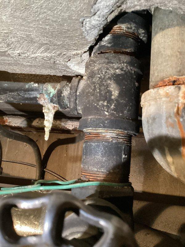 Completed HVAC maintenance agreement inspection of one boiler and two water heaters. Documented existing conditions with photographic evidence showing significant corrosion on pipe connections, threaded fittings, and valve assemblies, along with mineral deposits indicating long-term moisture exposure. Customer advised of aged equipment condition but declined replacement recommendations per explicit request for no upselling.