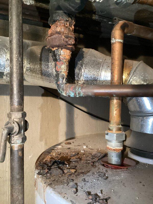 Completed HVAC maintenance agreement inspection of one boiler and two water heaters. Documented existing conditions with photographic evidence showing significant corrosion on pipe connections, threaded fittings, and valve assemblies, along with mineral deposits indicating long-term moisture exposure. Customer advised of aged equipment condition but declined replacement recommendations per explicit request for no upselling.