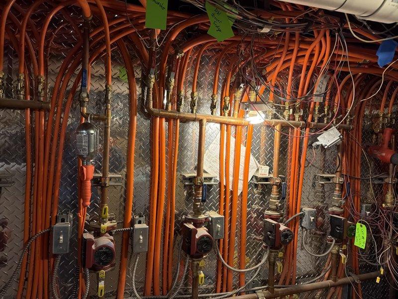 Replaced customer-provided circulator pump assembly under warranty coverage. The new Silentcore pump unit was installed within the hydronic heating system, with all copper refrigerant lines, PVC condensate drainage, electrical connections, and control wiring properly reconnected and secured. System valve assemblies and flexible connectors were verified for proper operation, and all mounting hardware was torqued to specification.