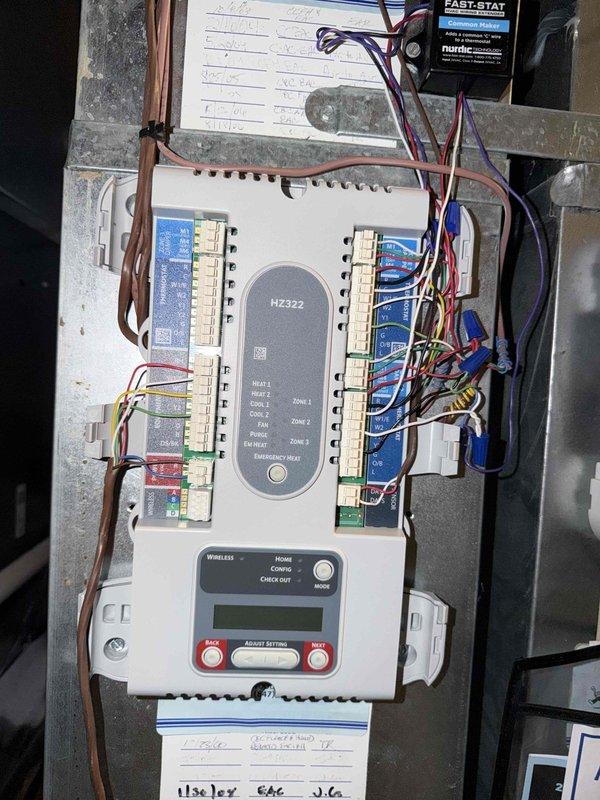 Completed return visit to replace defective HZ322 zone control board and dual venturi assembly under warranty. Removed failed zone board from HVAC control panel, installed replacement unit, and reconnected all zone wiring including heat, cool, fan, and emergency heat circuits. Verified proper communication with digital thermostat controller and tested all zone functions. Replaced dual venturi component on Navien heating system and confirmed proper operation of all mechanical connections, copper piping, and circulation pump. System tested and operational upon completion.