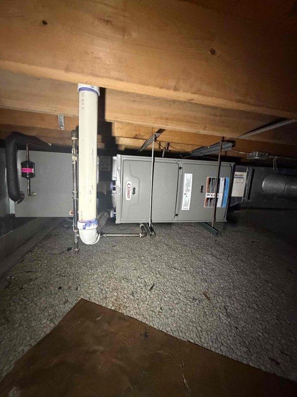 Completed comprehensive maintenance inspection on two horizontal furnace units installed in crawl space as part of seasonal HVAC agreement. Performed thorough visual assessment of both systems, checking all accessible components including heat exchangers, burner assemblies, and electrical connections. Verified proper operation of furnace controls and safety devices. Inspected PVC condensate drain lines and venting systems for proper installation and drainage. Evaluated condition of flexible ductwork connections and verified secure mounting of equipment. Utilized digital diagnostic equipment to measure and record system temperatures and operational parameters. Checked electrical panel connections and verified proper voltage supply to units. Documented equipment condition through photographic records showing current state of installations and measurement readings. Both furnace units operating within normal parameters with no immediate service needs identified at time of inspection.