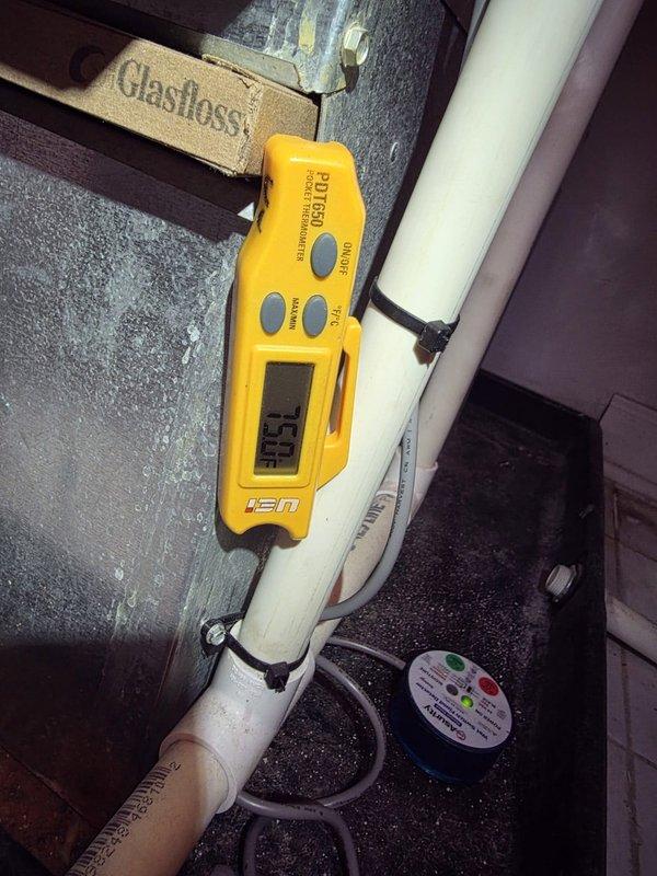 Returned to heat pump installation site to complete warranty work by installing additional wiring kit. Added control wiring to enable proper heat pump operation and integrated humidistat controls with the HVAC system. Verified proper communication between thermostat, heat pump unit, and humidity control components, with digital humidistat displaying correct readings at 62% RH in manual mode.