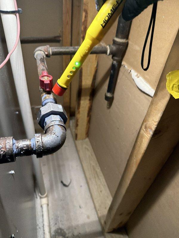 Responded to gas leak detected under stove by Nicor. Inspected gas piping system and identified loose valve connection at appliance supply line. Tightened valve fitting to manufacturer specifications and performed leak test using combustible gas detector to verify repair. Added plumbing service coverage to existing gas service agreement for continued maintenance and safety monitoring.