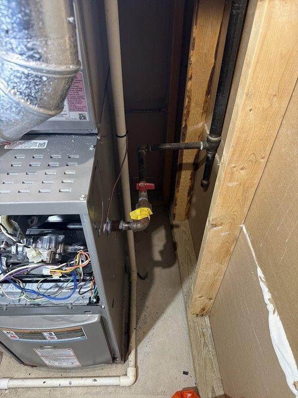 Responded to gas leak detected under stove by Nicor. Inspected gas piping system and identified loose valve connection at appliance supply line. Tightened valve fitting to manufacturer specifications and performed leak test using combustible gas detector to verify repair. Added plumbing service coverage to existing gas service agreement for continued maintenance and safety monitoring.