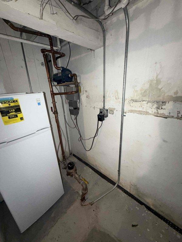 Completed comprehensive maintenance inspection on residential boiler system as part of scheduled agreement service. Verified proper operation of all heating components, inspected copper piping connections, pressure gauge readings, and safety controls. Documented system condition with photos showing boiler unit, water heater, circulation pump, and associated plumbing infrastructure all functioning within normal parameters.