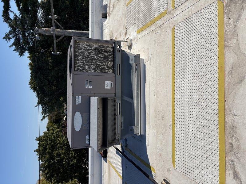 Completed rooftop unit replacement due to cracked heat exchanger identified during inspection. Removed existing failed RTU and installed new commercial package unit on flat membrane roof, ensuring proper mounting, electrical connections, and conduit routing. Unit tested and operational with all safety controls verified.