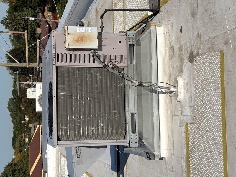 Completed rooftop unit replacement due to cracked heat exchanger identified during inspection. Removed existing failed RTU and installed new commercial package unit on flat membrane roof, ensuring proper mounting, electrical connections, and conduit routing. Unit tested and operational with all safety controls verified.