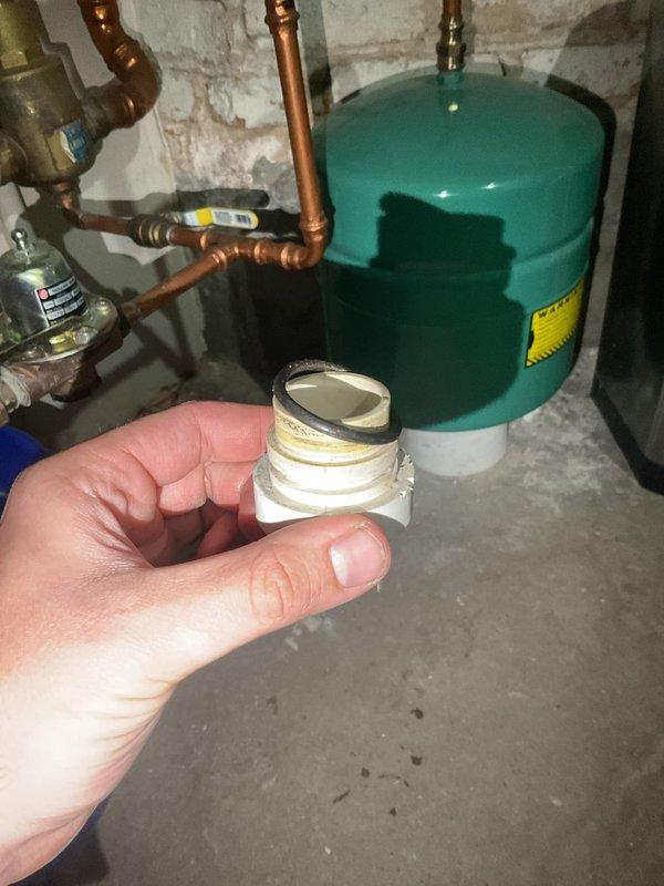 Responded to callback for water heater leak following maintenance performed on 9/24. Inspected Navien tankless water heating system and identified leaking sediment filter housing as source of issue. Replaced filter cartridge and verified all connections were properly sealed and system operating at 82°F with no active leaks detected.