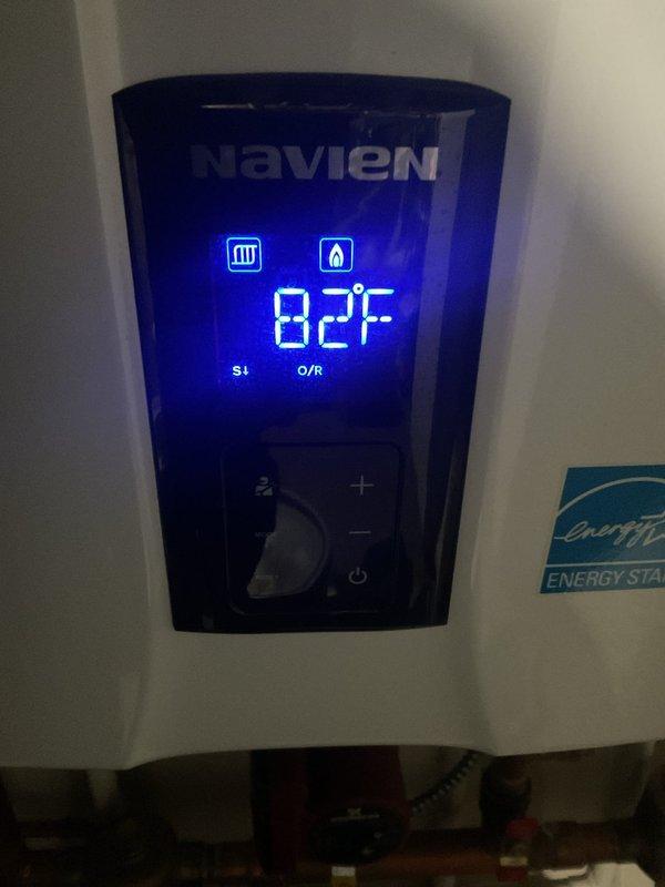 Responded to callback for water heater leak following maintenance performed on 9/24. Inspected Navien tankless water heating system and identified leaking sediment filter housing as source of issue. Replaced filter cartridge and verified all connections were properly sealed and system operating at 82°F with no active leaks detected.