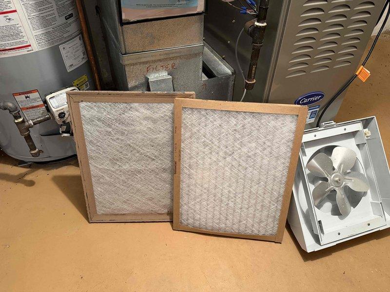 Completed comprehensive maintenance on three furnaces and two humidifiers per agreement terms. Replaced standard air filters with 16x20x1 and 16x25x1 units, removed accumulated dust and debris from filter media, and cleaned humidifier drain pans which contained sediment buildup. All equipment inspected and operating within normal parameters.