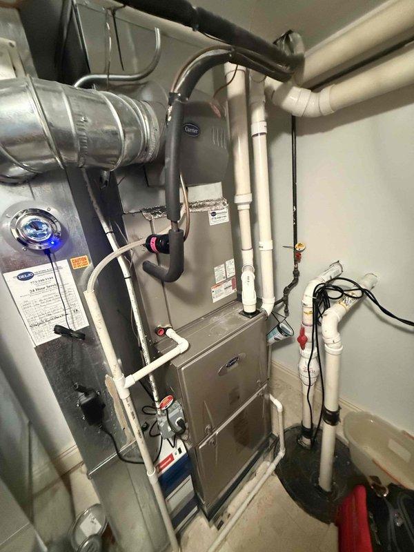 Completed comprehensive maintenance on three furnace systems and associated humidifiers as part of annual agreement service. Replaced air filters including two 20x20x4 filters and one 16x25x4 filter, which showed significant accumulation of dirt, debris, and discoloration. Inspected Carrier furnace unit, ductwork connections, PVC condensate drainage system, and all associated HVAC components to ensure proper operation and system integrity.