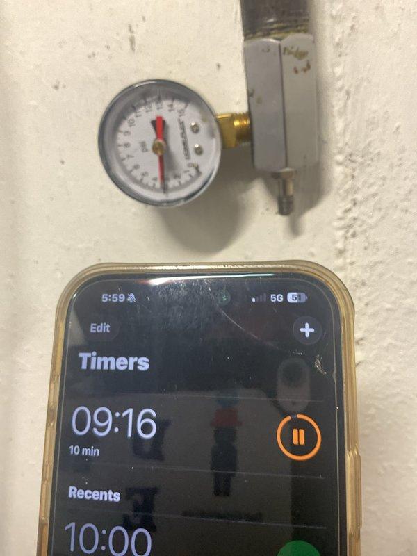 Responded to gas shut-off due to leak in dryer gas line. Performed pressure test on gas system using manometer gauge with 10-minute hold time to verify leak location and system integrity. Inspected HVAC equipment and gas piping connections in utility area to assess extent of leak and determine necessary repairs.