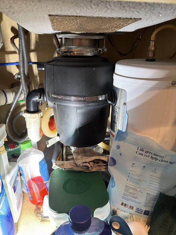 Completed comprehensive plumbing inspection of residential property, examining all accessible fixtures, drains, and supply lines throughout the home. Inspected utility sink and cabinet plumbing in laundry area, verifying proper drainage and supply connections. Examined kitchen sink plumbing system including InSinkErator Pro 850-T garbage disposal unit, associated drain lines, flexible supply connections, and white PVC drainage piping for leaks or deterioration. Verified water filtration system connections and proper operation. Replaced two 16x25x4 air filters on HVAC furnace units as part of routine maintenance. All plumbing fixtures, connections, and drainage systems found to be functioning properly with no leaks or issues identified during inspection.