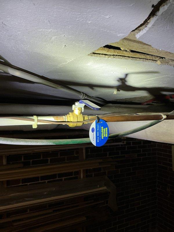 Completed annual maintenance inspection on boiler system under service agreement. Documented existing conditions including expansion tank, piping connections, and system components with photographic evidence. Observed significant moisture infiltration and efflorescence on basement brick wall adjacent to equipment, indicating ongoing water seepage issues that may require future attention to prevent equipment corrosion and structural deterioration.