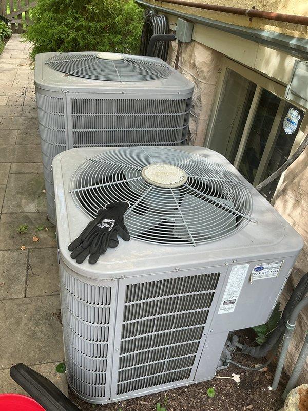 Replaced failed contactors on both outdoor condensing units to restore proper compressor operation. Installed TRADE PRO hard start capacitors (compressor savers) rated for 2.5-5 ton systems on Unit 1 and Unit 2 to reduce startup amperage draw and extend compressor lifespan. Verified proper electrical connections, tested all components with diagnostic equipment, and confirmed both Carrier units are operating within manufacturer specifications.