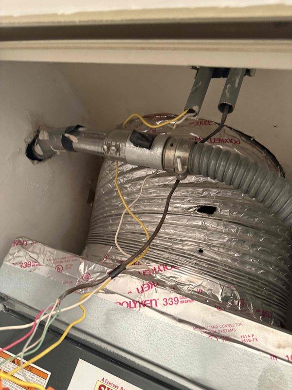 Conducted on-site evaluation for complete air conditioning system replacement and assessed feasibility of adding mini split system. Inspected existing evaporator coil assembly within air handler cabinet, documented current electrical connections and ductwork configuration, and evaluated plumbing connections at base of equipment to determine replacement requirements and compatibility with proposed new systems.