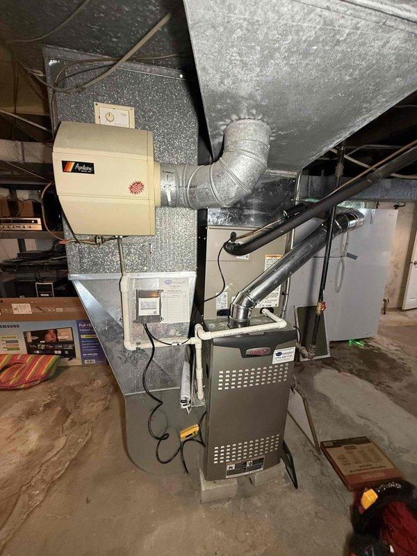 Performed comprehensive maintenance check on two furnaces, water heater, and Aprilaire humidifier system as part of maintenance agreement. Replaced air filters including #10, 16x25x1, and 16x20x1 filters. Verified furnace operating temperature at 127.5°F and inspected all ductwork connections and mechanical components for proper operation.