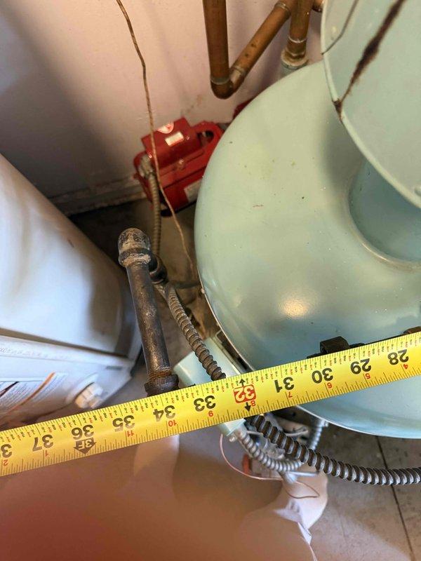 Performed an on-site assessment for replacement of an existing A.O. Smith copper-tube boiler, with easy access to the mechanical area. Documented the existing equipment, flue/vent piping, and mixed galvanized, black iron, and copper supply/return piping, including isolation valves, unions, and circulator components, and took clearance measurements to verify fit for the new unit. Piping and flue showed minor surface wear and discoloration but no significant corrosion, and the estimate was prepared for the boiler replacement.