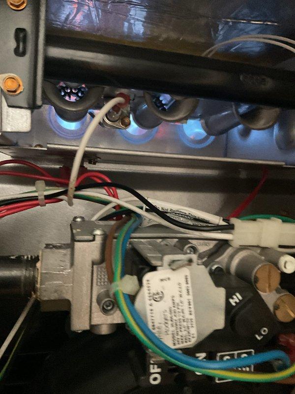 Performed scheduled maintenance on the gas furnace, air conditioning system, and water heater under the maintenance agreement. Inspected the furnace burner assembly, gas valve, flame sensor, and wiring, verifying stable blue burner flames and proper ignition operation. Inspected the outdoor condenser's electrical compartment, including the run capacitor, contactor, and wiring connections, and documented heavy dust and grime accumulation on the components.