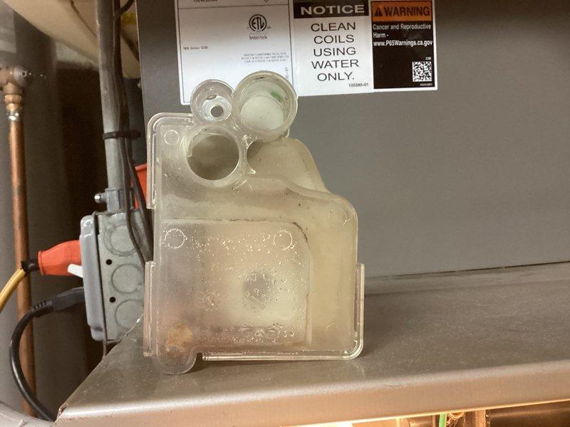Performed annual maintenance on one furnace and one humidifier, including replacement of the 16x25x1 air filter and inspection of the condensate drain system. Inspected the condensate pump and clear drain trap, noting residue buildup in the trap and staining on the floor below the pump that indicates prior moisture, and verified the pump was powered and operating with its indicator light on.
