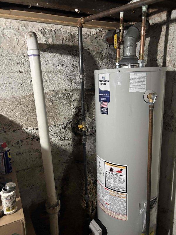 Completed a full commercial HVAC system changeout, replacing the furnace, condensing unit, evaporator coil, and thermostat, and installing a new Bradford White gas water heater. Reconnected the gas supply with shutoff valves, flue venting, and water supply and drain piping, then verified proper operation of all new equipment.