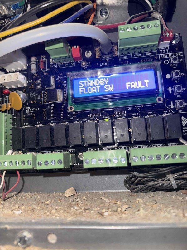 Responded to a no-cooling call on a 5-year-old split system and inspected the attic-mounted air handler, where the control board displayed a "STANDBY – FLOAT SW FAULT" code, indicating the condensate overflow safety switch had tripped and locked out cooling operation. The evaporator coil and cabinet showed no signs of frost, ice, or corrosion, and the blower assembly appeared intact. Addressed the float switch fault condition to restore normal operation and ensure proper condensate drainage and system cooling.
