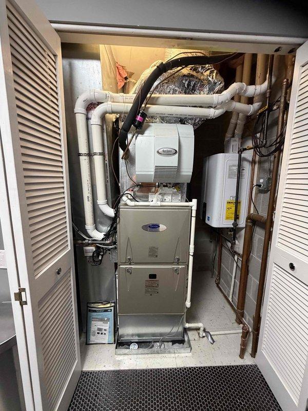 Performed scheduled maintenance on the gas furnace and tankless water heater, including replacement of the 20x25x1 air filter and inspection of the furnace, humidifier, condensate drain, and PVC venting, with no leaks, corrosion, or damage observed. Flushed and descaled the tankless water heater at the customer's request, cleaning the inlet water filter screen and verifying proper operation upon completion.