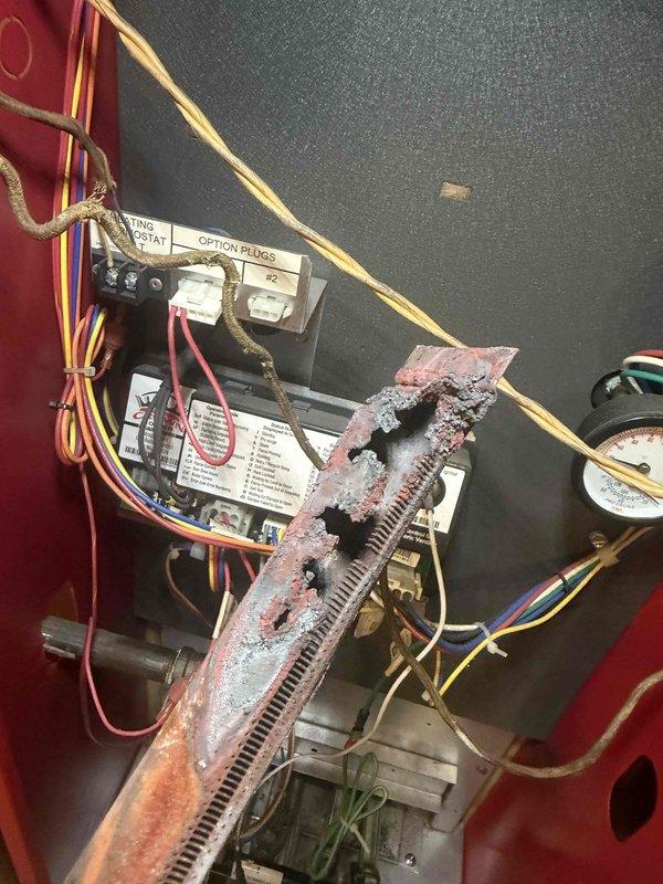 Performed maintenance inspection on a gas furnace approximately 12 years old, including a borescope inspection of the heat exchanger and flue passages, which revealed heavy rust, scale buildup, and corrosion along with debris accumulation. Found the heat exchanger severely deteriorated with multiple perforations and burn-through holes, along with brittle wiring and aged control components, creating a potential safety hazard. Documented findings with photographs and recommended furnace replacement.