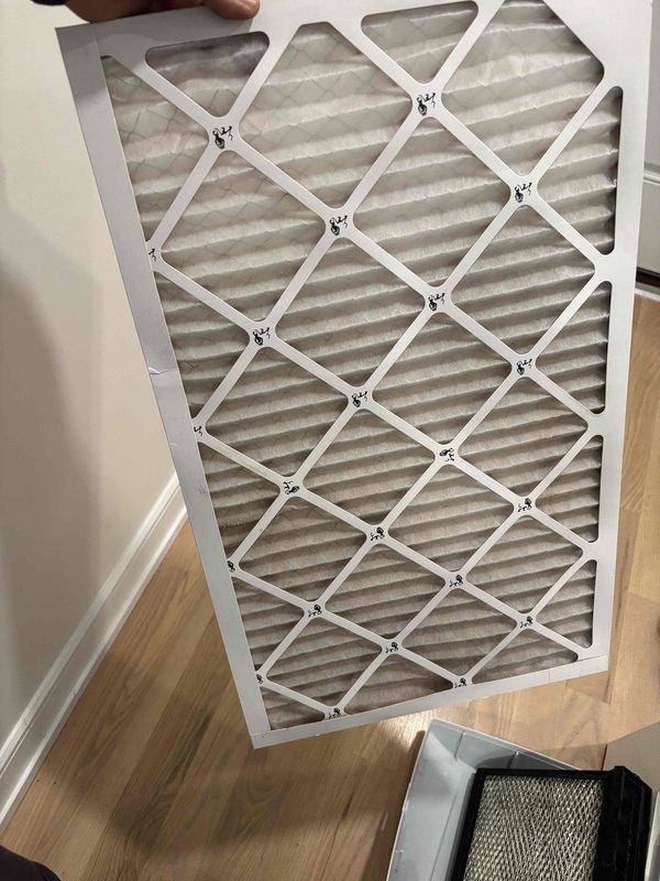 Performed scheduled maintenance on one furnace and one humidifier, including replacement of the 17x28x1 pleated return air filter, which showed dust loading and frame damage. Inspected the blower and plenum area, noting light dust and powder residue on the plastic housing, and verified the humidifier assembly and drain fitting were in serviceable condition. System was left operating and ready for the heating season.