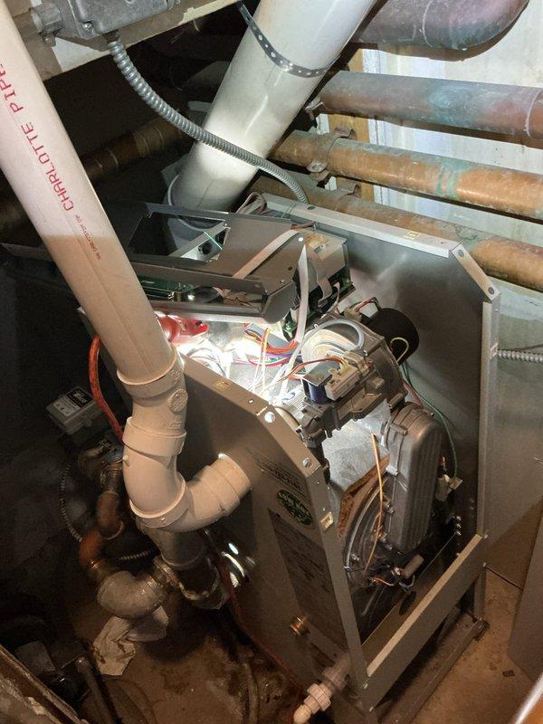 Returned to the site and replaced the water treatment beads and a motor on the whole-building water heater system. Installed new blower motor assemblies per manufacturer installation instructions, reconnected wiring and fittings, and verified proper operation of the unit following the repair.