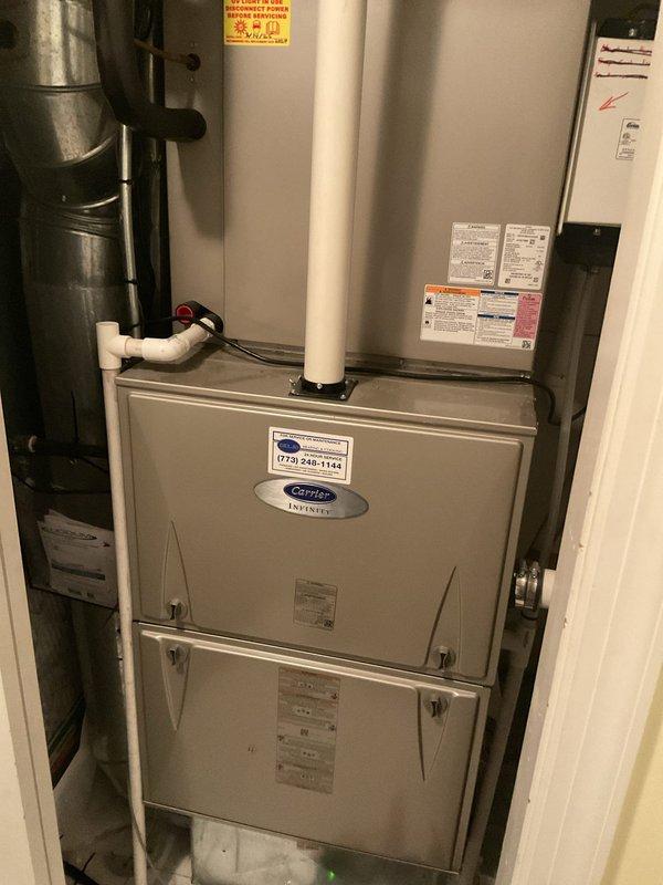 Performed scheduled maintenance on a Carrier Infinity gas furnace, an A.O. Smith ProLine XE power-vent water heater, and a humidifier, including replacement of the 20x25x1 air filter and the 990-13 humidifier pad. Inspected the furnace cabinet, PVC intake and exhaust piping, wiring, and ductwork connections, as well as the water heater's power vent blower assembly, venting, supply piping, and expansion tank. Equipment was found in good condition with no visible rust, leaks, or damage, and all components were left operational.