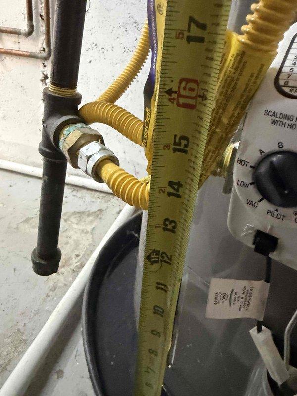 Performed scheduled maintenance on one furnace and one humidifier, including replacement of the 20x25x1 return air filter. During the visit, documented the adjacent gas water heater installation, verifying the yellow corrugated flexible gas connector, black iron gas piping with union and capped nipple, and gas control valve, with no visible rust, leaks, or breakage. Confirmed the T&P relief valve discharge piping is insulated and routed properly, and that the tank is seated in a drain pan.