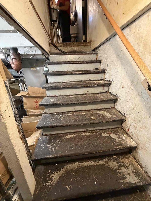 Performed an on-site evaluation for replacement of the existing Lennox gas furnace located in the basement utility area, inspecting the unit, PVC venting, supply plenum and ductwork, gas and electrical connections, and clearances adjacent to the water heater. Documented equipment condition and installation access, noting a narrow, steep stairwell and stored items around the furnace that will need to be cleared prior to removal and installation of the new unit.