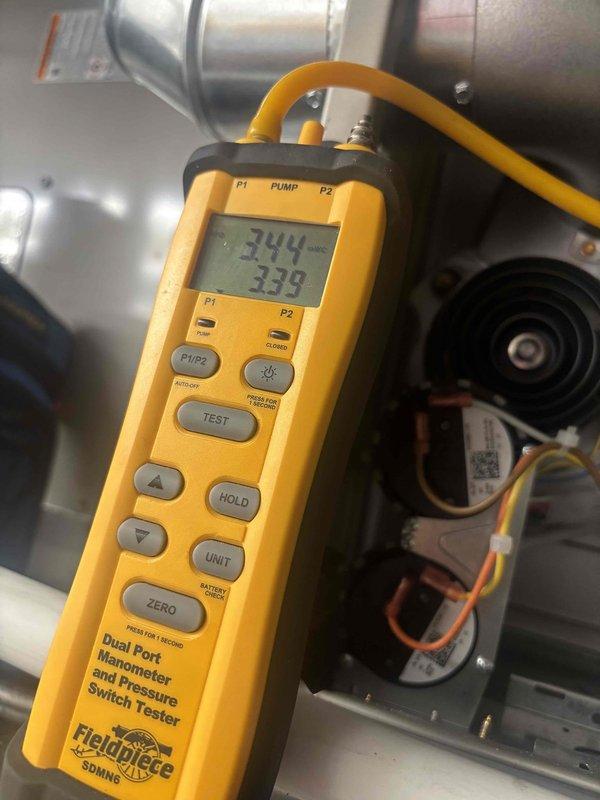 Completed system start-up of the heating portion and water heater installation. Performed gas pressure verification using a digital dual-port manometer, measuring and confirming manifold and supply pressures within manufacturer specifications. Verified proper operation of the pressure switches, inducer/blower assembly, and associated wiring connections, with no visible damage or abnormalities noted.