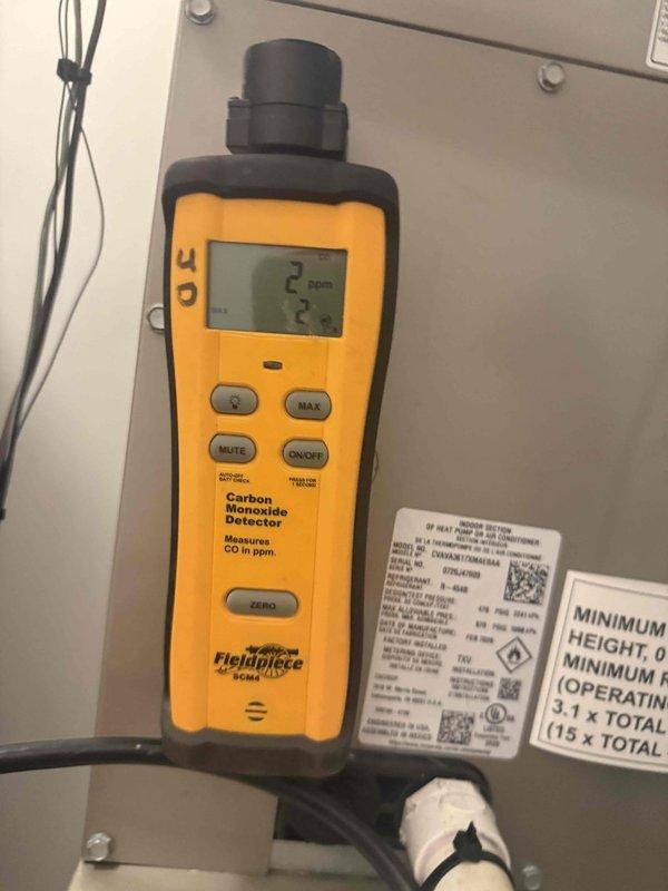 Performed scheduled maintenance on the furnace, including replacement of the 16x25x1 filter, and verified ambient carbon monoxide at the unit at 2 ppm, within safe limits. Inspection of the adjacent water heater revealed heavy corrosion and mineral deposits at the top fitting connection with moisture present, indicating an active leak; recommend further evaluation and repair or replacement of the water heater.