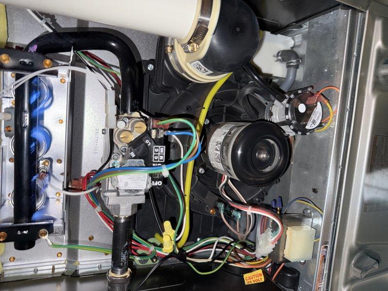 Performed scheduled maintenance on two furnaces and humidifiers, replacing 16x25x1 air filters and humidifier water panels (990-13 and #35 models) and verifying proper operation. Inspected burner assemblies, confirming stable blue flame, and checked the gas valve, draft inducer, pressure switch, and wiring connections with no rust, frost, or damage found. Took measurements at the plenum access panel to confirm system performance.