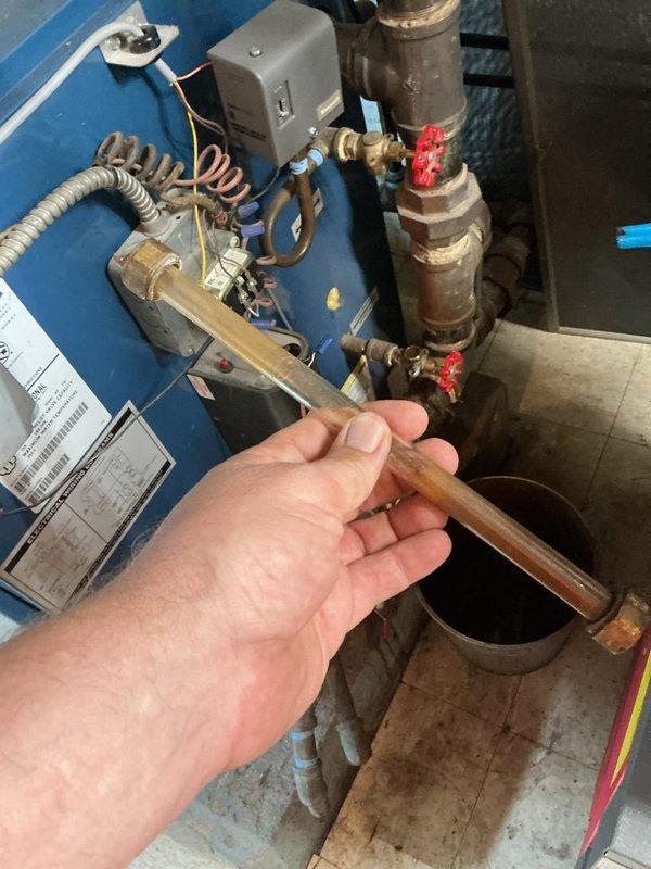 Performed scheduled maintenance on two steam boilers, including draining and flushing the boiler blowdown lines to remove sediment and sludge from the system. Inspected the gauge glass tubing, valves, piping connections, and electrical controls, with threaded fittings resealed using thread-sealing tape as needed.