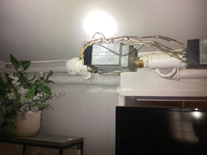 Performed scheduled maintenance on a Crown boiler system under the service agreement, inspecting the burner assembly, gas valve components, and internal control wiring with the front panel removed. Reviewed the exposed, loosely routed low-voltage wiring at the junction box and terminal connection on the piping and recommended securing and tidying the conductors; the work area was left clear of tools and equipment.