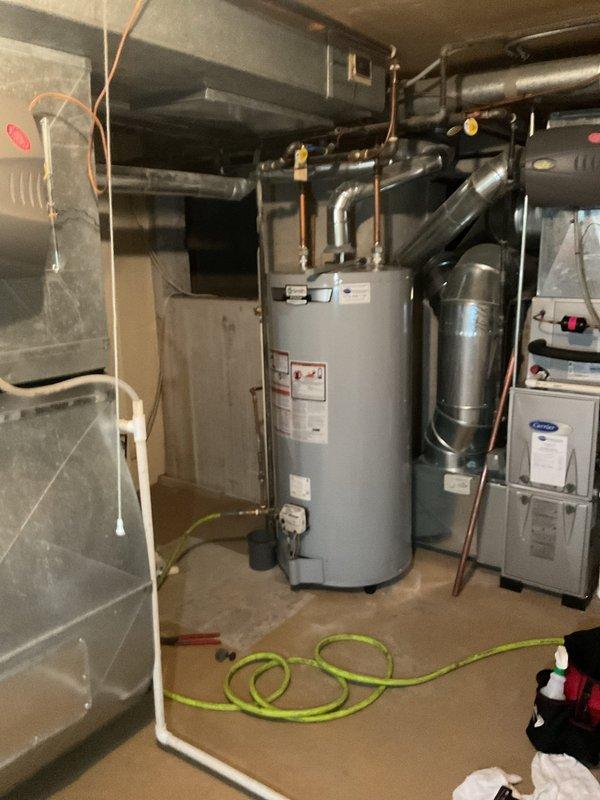 Replaced two dielectric unions and the P-trap beneath the basement sink, restoring proper isolation between dissimilar metals and a watertight drain connection. Pressure-tested the new fittings and verified there were no leaks.
