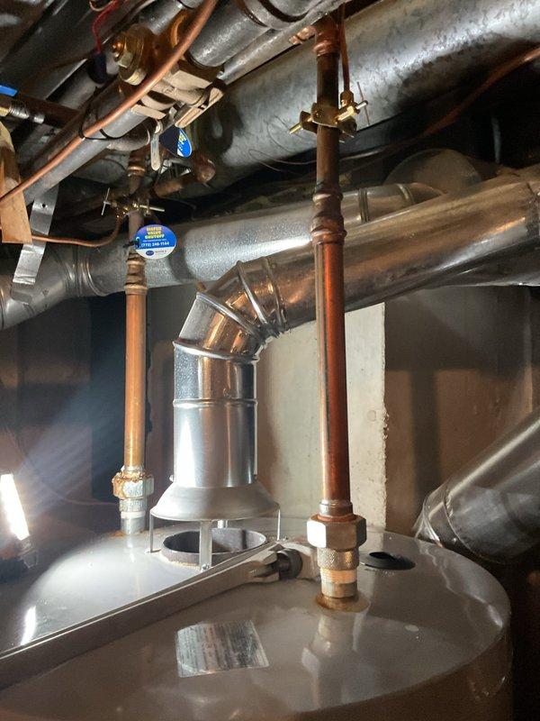Replaced two dielectric unions and the P-trap beneath the basement sink, restoring proper isolation between dissimilar metals and a watertight drain connection. Pressure-tested the new fittings and verified there were no leaks.