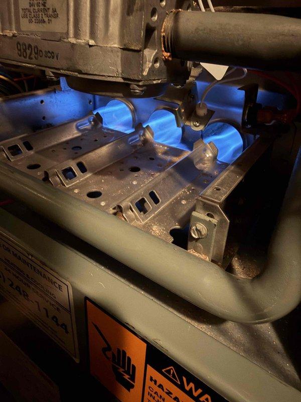 Responded to a no-heat callback following prior maintenance and inspected the gas furnace burner compartment, where burners were igniting and producing a stable blue flame. Verified the gas valve, gas piping, shutoff valve, and electrical connections, with no visible leaks, corrosion, or damage. Cleaned light dust and debris from the burner assembly and confirmed the unit was restored to proper operation.