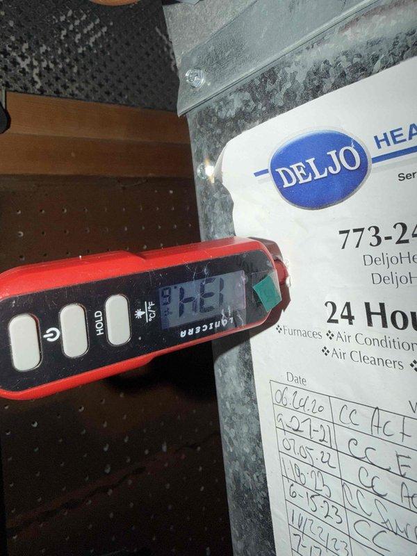 Responded to a no-heat call on a Carrier gas furnace with a coil cabinet in a closet installation. Inspected the unit and verified supply-air temperatures at the duct with a digital thermometer, and checked the condensate PVC drain, electrical connections, and refrigerant line set for proper condition. Restored heating operation and confirmed the furnace is operating normally.