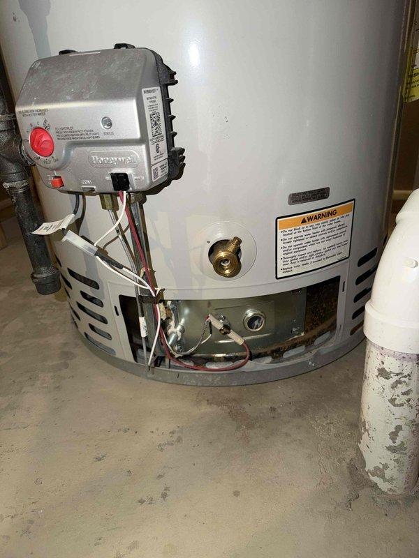 Performed seasonal maintenance on one furnace, one humidifier, and one gas water heater under the maintenance agreement. Inspected the furnace burner flame through the sight glass and confirmed a stable blue flame, and serviced the humidifier. Inspected the water heater and noted rust, discoloration, and debris at the burner access area, recommending monitoring and further cleaning or evaluation as needed.