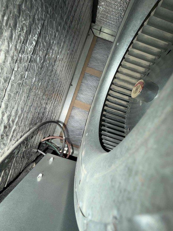 Performed annual maintenance on the furnace, humidifier, and water heater, verifying a single furnace was present. Inspected and cleaned the furnace blower assembly and cabinet interior, confirming wiring and insulation were intact with no signs of frost or significant corrosion. Inspected the evaporative humidifier, noting heavy mineral scaling on the pad, and serviced it to restore proper operation and water flow.